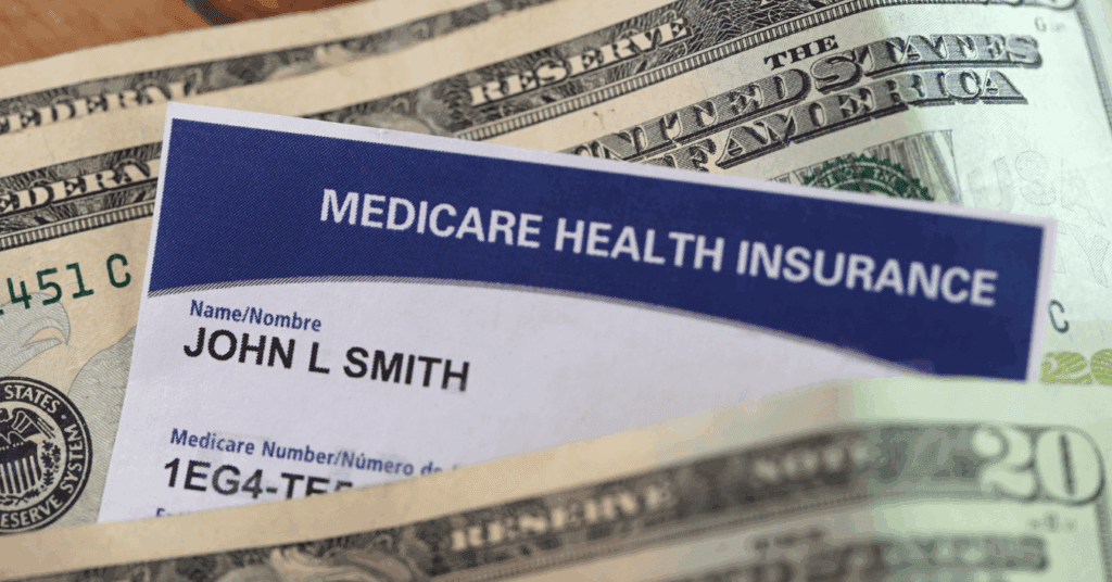 Basics of medicare. A medical insurance card is poking out through a number of 20 dollar notes, lying flat on a table. The medical insurance card reads "medicare health insurance" and is owned by fictional character, John L. Smith.